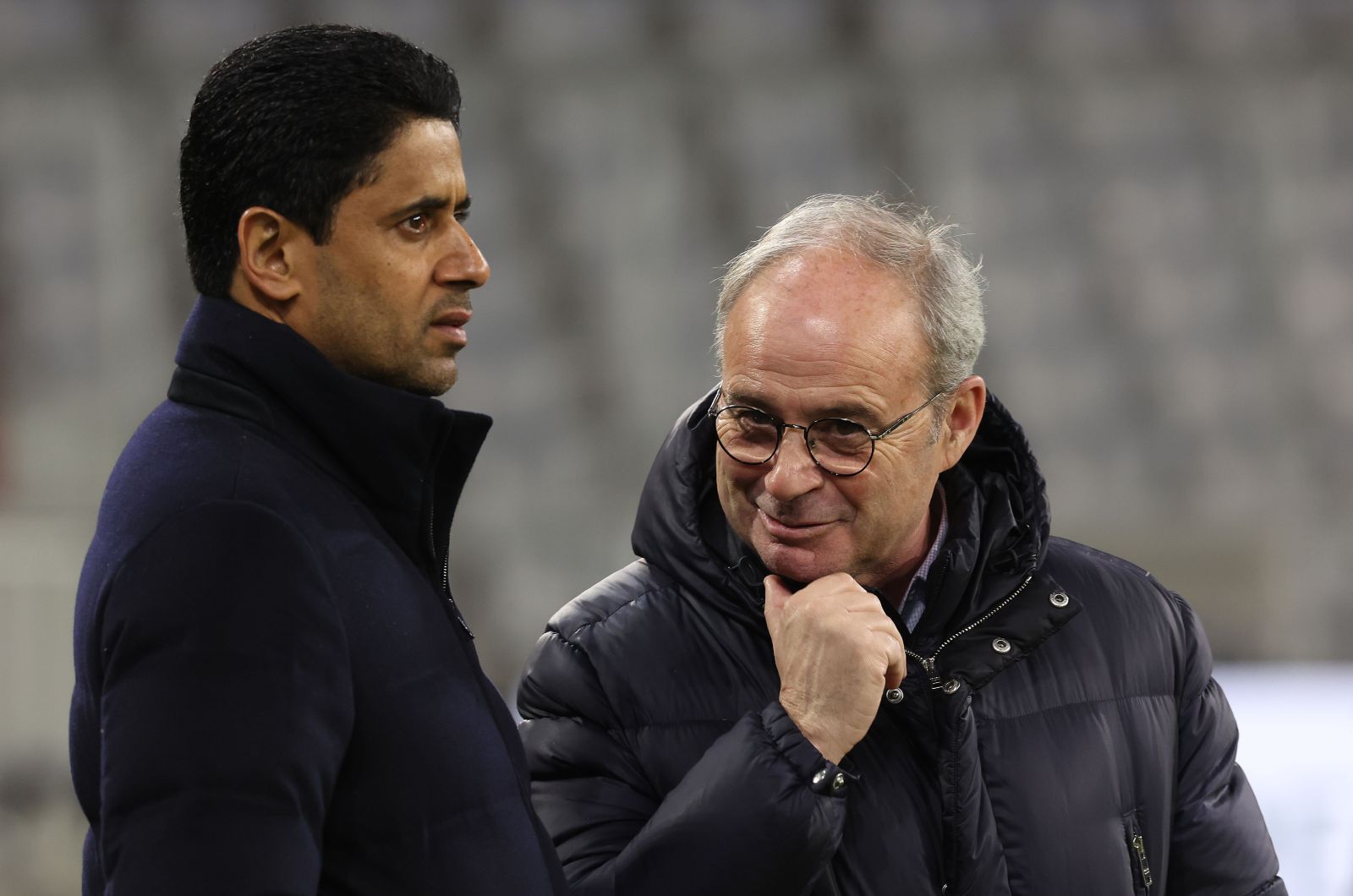 MUNICH, GERMANY - MARCH 07: Lu&iacute;s Campos (R), Sporting director of Paris Saint-Germain talks to Nasser Ghanim Al-Khelaifi, President of Paris Saint-Germain during a Paris Saint-Germain Training session ahead of their UEFA Champions League round of 16 match against FC Bayern M&uuml;nchen at Allianz Arena on March 07, 2023 in Munich, Germany.
