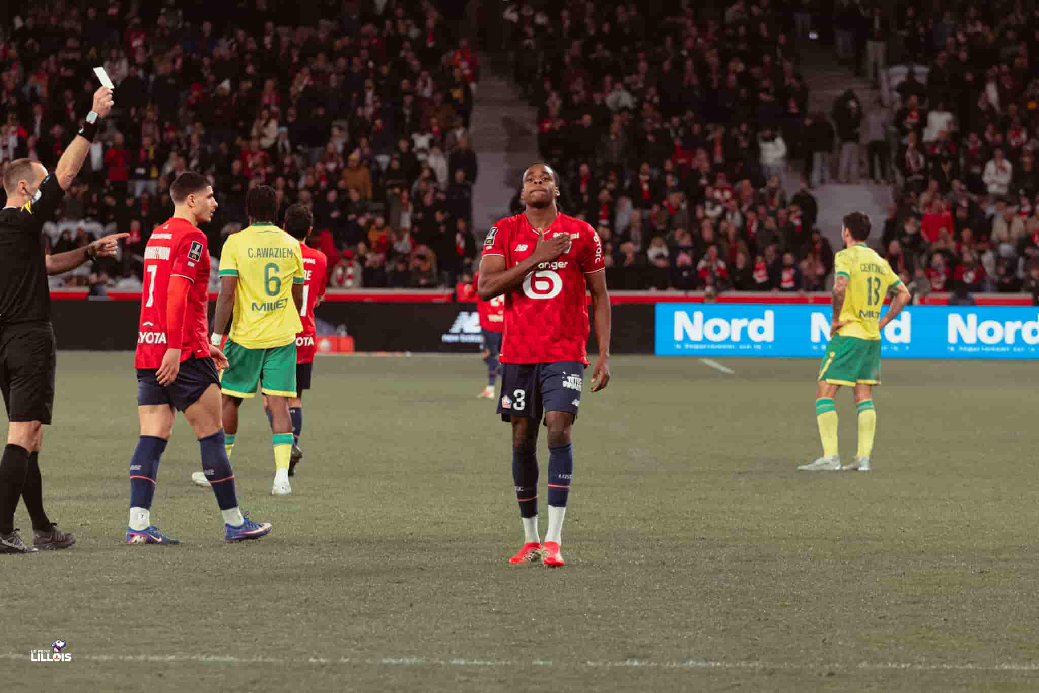 La main sur le c&oelig;ur : Nathan Ngoy c&eacute;l&egrave;bre son but pendant LOSC - FC Nantes.
